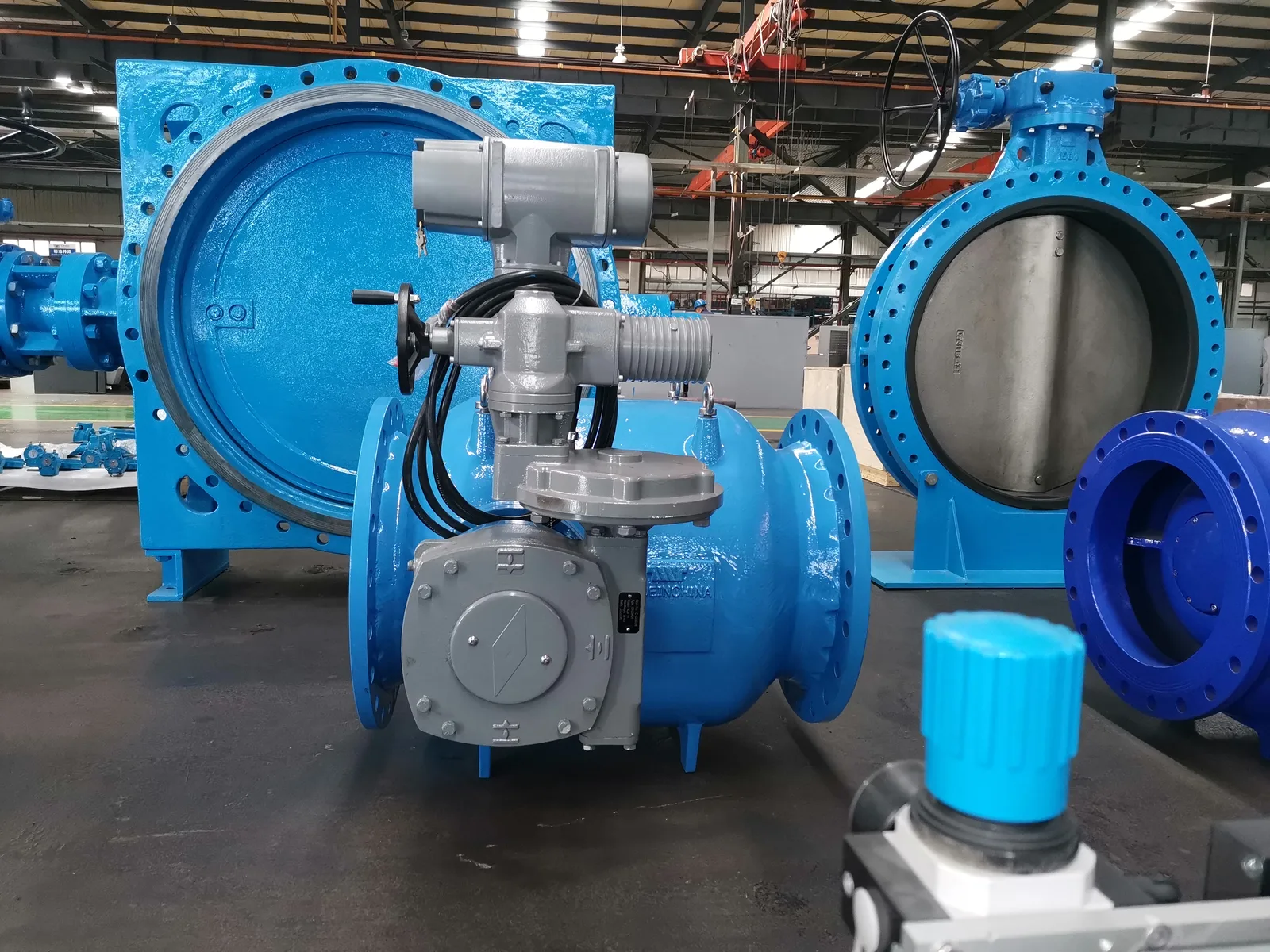 Large industrial valves in a workshop setting